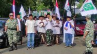 Rombongan Bacaleg PKB Kota Malang berjalan menuju  KPU. (rhd) - PKB Kota Malang Usung 45 Bacaleg Targetkan 12 Kursi