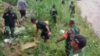 Babinsa Kiduldalem Bersama Warga Bersihkan Sungai Brantas Cegah Banjir