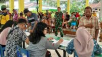 Babinsa Koramil Sukun pendampingan pembagian bantuan pangan Tahap III 2024. (ist) - Babinsa Koramil Sukun Pendampingan Pembagian Bantuan Pangan Tahap III 2024