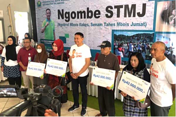 BPJS Ketenagakerjaan bersama Pemkot Malang serahkan santunan ahli waris pekerja. (ist) - BPJS Ketenagakerjaan Serahkan Santunan Ahli Waris Pekerja Insentif Pemkot Malang