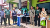 Babinsa Koramil Blimbing Dampingi Penyaluran Bantuan Pangan Warga Purwantoro