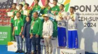 Ketua KONI Jatim berfoto bersama Atlet-atlet peraih medali asal Jawa Timur. (ist) - Atlet PON Cabor Wushu dan Selam Kota Batu Kembali Sumbang Medali untuk Jatim