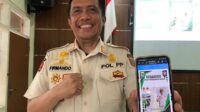 Kasatpol PP Kabupaten Malang, Firmando Hasiholan Matondang saat menunjukkan website Kasandra. (Seru.co.id/wul) - Satpol PP Kabupaten Malang Adopsi Kasandra untuk Optimalkan Penegakan Perda Penanganan Trantibum