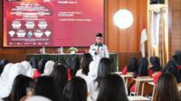Paparan seputar Tahapan Pilkada oleh Ketua PPK Kecamatan Batu. (ist) - PPK Batu Sosialisasi Pilkada 'Goes To School' di SMKN 1 Batu