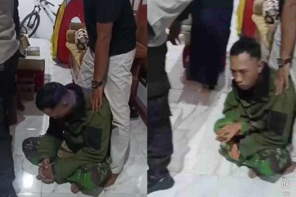 Terduga TNI gadungan saat diamankan di Mapolsek Gumukmas Jember. (ist) - TNI Gadungan di Jember Babak Belur Usai Tertangkap Massa Hendak Curi Motor