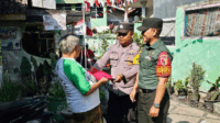Babinsa Klojen Ajak Warga Bareng Pasang Bendera Merah Putih