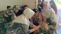 Babinsa Kedungkandang Dampingi Nakes dan Kader Posyandu Arjowinangun Sosialisasi Vaksin Campak