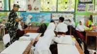 Babinsa Kedungkandang Dampingi Distribusi MBG di Sekolah Wilayah Buring